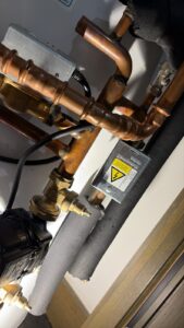 Hot water cylinder 2-port valve replacement completed by On Time Plumbers in E1