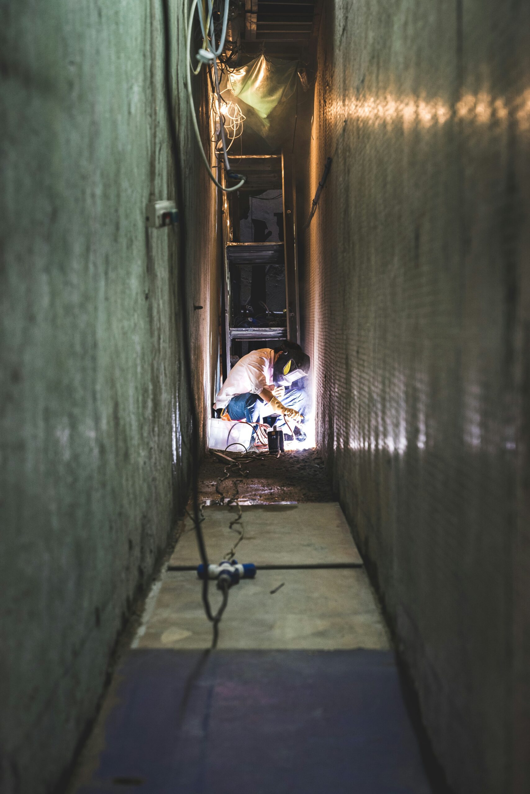 A plumber working on toilet installation